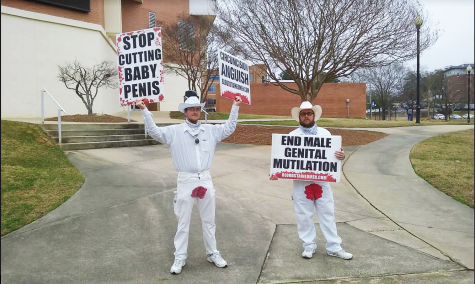 Bloodstained Men volunteers protest male circumcision on main campus