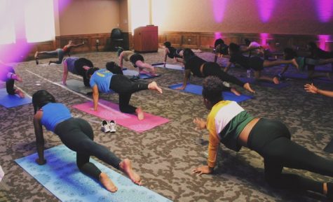Attendees participate in the yoga class. Photo courtesy of Skylar Diehl.