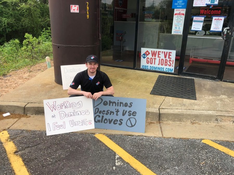 Theo Pound protests outside of the Bradley Park Dominos. Photo courtesy of Mamie Pound.