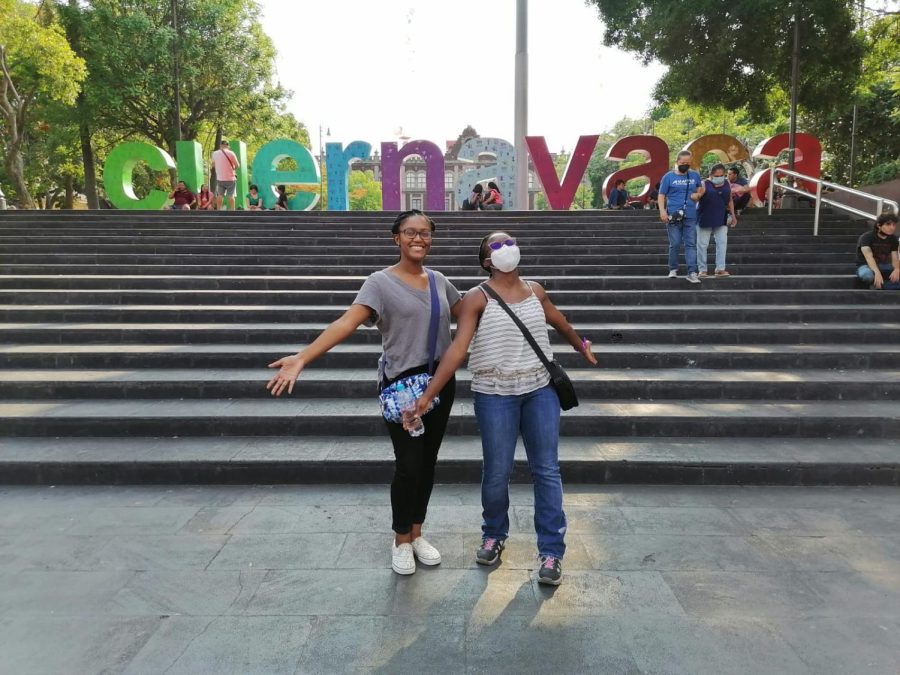 Ebony Robinson and Nahdirah Muhammad in front of the CUERNAVACA sign in la plaza.