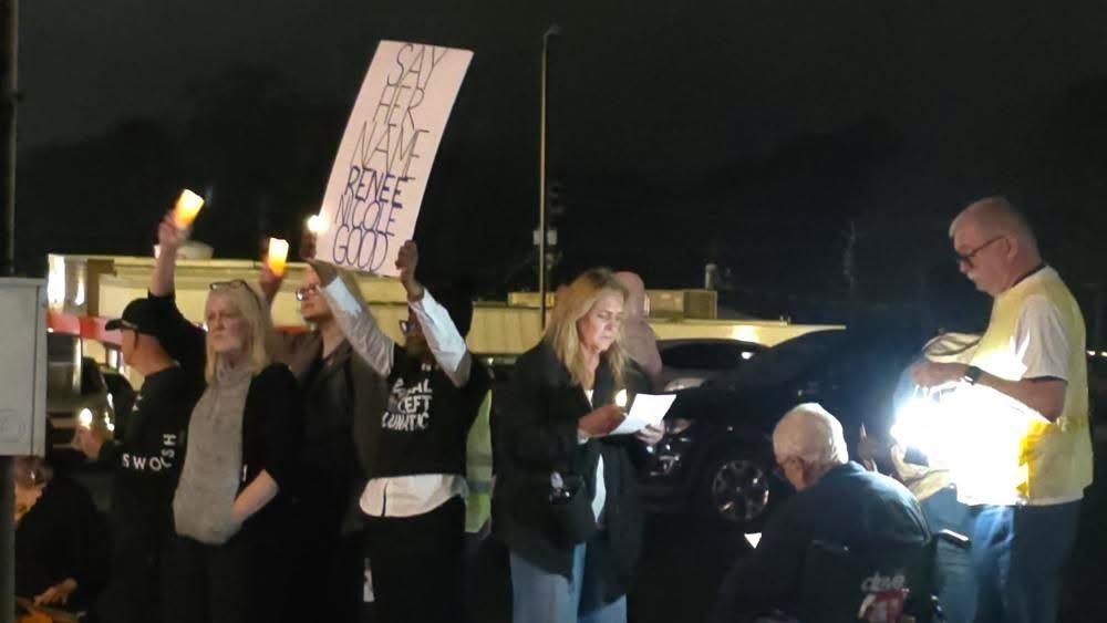 Protestors assembled on the sidewalk of Manchester Expressway