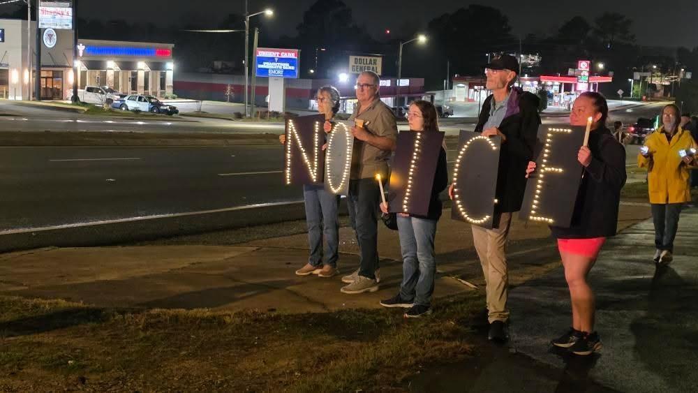 Protestors made a light up sign, spelling out "NO ICE" 